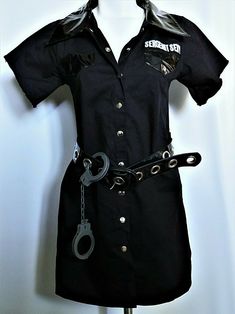 a black shirt dress with handcuffs attached to it