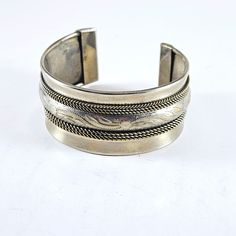 A simple yet elegant vintage metal bracelet in silver tone with really nice embossed design. See pictures for condition and message us with any questions, we're happy to help! Visit our Etsy eBay shop and Old Stuff Vintage Sales on eBay for more great items!  Subscribe to catch future deals - new listings all the time! Classic Silver Metal Bangle, Antique Etched Adjustable Cuff Bracelet, Vintage Oxidized Antique Silver Bracelet, Vintage Sterling Silver Bangle With Oxidized Finish, Vintage Oxidized Sterling Silver Bangle Bracelet, Antique Silver Nickel-free Bangle Bracelet, Vintage Antique Silver Stamped Bracelets, Antique Silver Nickel-free Bracelet, Vintage Silver Bracelet With Oxidized Finish