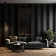 a living room with black walls and wood flooring on the wall, two couches in front of a coffee table