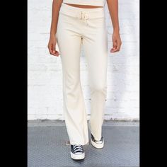 Soft Cotton Blend Tie Yoga Pants With A Big Flare Pant Leg. Fabrics: 100% Cotton Measurement: 10" (30 Cm) Rise, 34" (81 Cm) Inseam, 15" (66 Cm) Waist (Stretches) Made In: Italy Chic Fitted Full-length Sweatpants, Chic Fitted Straight Sweatpants, Fitted Straight Chic Sweatpants, Trendy Fitted Sweatpants For Loungewear, Fitted Straight Sweatpants For Loungewear, Trendy High Waist Fitted Sweatpants, Trendy Fitted High Waist Sweatpants, Chic Fitted Sweatpants Trousers, Fitted Athleisure Sweatpants For Spring