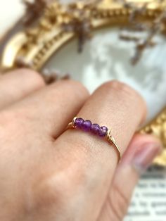 14k Gold Filled Gemstone Rings For Gift, Dainty 14k Gold Crystal Ring With Accent Stones, 14k Gold Amethyst Open Ring, Gift Gemstone Rings In 14k Gold Filled, Amethyst Birthstone Crystal Ring In Open Style, Amethyst Crystal Open Ring With Birthstone, Dainty 14k Gold Amethyst Ring, Purple Open Ring Birthstone Ring, Dainty 14k Gold Amethyst Ring For Anniversary