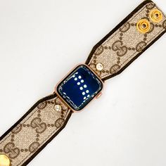 The "Willow" is a beauty and is a hand-crafted designer watchband made with olive green suede leather and topped with the classic brown GG monogram material from a real bag. The band is secured with gold fitting connectors that will slide into your apple watch securely. There are two gold high-quality snaps have been added to allow for adjustability and comfort fit. Each band is approximately 3.5 inches with snaps at .5 and 1.25. The secure clear crystal adds a nice little bling to the band! Fit Designer Brown Adjustable Bracelet, Designer Adjustable Brown Bracelet, Luxury Adjustable Apple Watch Band For Gift, Timeless Brown Jewelry With Bracelet Strap, Luxury Brown Leather Strap Bracelets, Timeless Brown Bracelet Strap Jewelry, Luxury Brown Bracelets With Leather Strap, Luxury Brown Watch For Gift, Luxury Gold Bracelets With Leather Strap