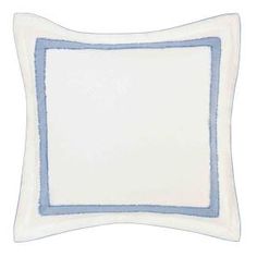 a white and blue pillow with an embroidered border