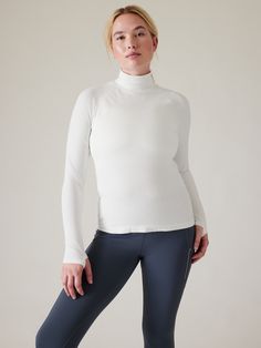 FOR: Training in cold weather climates FEEL: Seamless construction for maximum comfort and minimal chafing FAVE: Thumbholes hold sleeves in place and keep warmth in Fitted next to the body Regular length, hits at low hip T-neck Body length in size medium: Regular: 24".