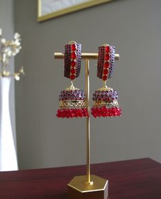 Red & Gold Jhumka Earrings perfect for any Pakistani/Indian wedding event! **All products are handmade and triple checked before shipping to ensure premium quality** Elegant Red Jhumkas For Festive Occasions, Red Elegant Jhumkas For Celebration, Bollywood Ruby Danglers For Festive Occasions, Elegant Red Danglers For Festive Occasions, Elegant Red Chandbalis With Cutdana, Elegant Red Danglers For Festive Events, Elegant Red Festive Danglers, Red Drop Earrings Danglers For Wedding, Festive Heavy Ruby Jhumkas