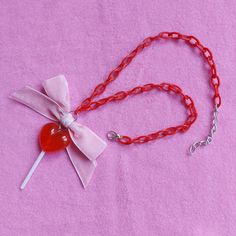 This necklace is made with a resin lollipop charm (that has a real plastic lollipop stick), a pink velvet ribbon bow and a red acryl chain. There is a small chain on the end of the necklace with which you can adjust the lenght of the necklace.  Shipping Information: All our order are shipped within 2 weeks after ordering and are shipped with track and trace.  Please keep in mind that these jewelry and accessories are made for adults/adult sizes Lollipop Necklace, Candy Fairy, Kawaii Candy, Heart Lollipop, Jewelry Kawaii, Pastel Heart, Pastel Jewelry, Lollipop Sticks, Kawaii Jewelry