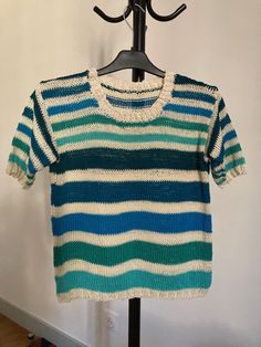 Summer sweater, in natural cotton, blue and green/ecru stripes. Short sleeves. Round neckline. Size S (38). Other colors or sizes on order. Spring Knit Tops With Horizontal Stripes, White Knit Sweater With Horizontal Stripes, Knit Crew Neck Sweater With Horizontal Stripes, Knit Sweater With Horizontal Stripes And Crew Neck, Fitted Horizontal Stripe Crew Neck Top, Striped Knit Tops For Spring, Striped Crew Neck Sweater For Spring, Striped Cotton Sweater For Fall, Blue Cotton Knit Sweater