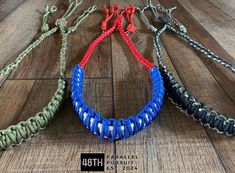 three different colors of bracelets on a wooden floor with the caption'4th july '