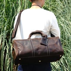 Crafted from the finest, vintage-look leather, this exceptionally versatile duffle bag seamlessly blends style and functionality, tailored to accommodate a variety of belongings, from clothing to your trusty laptop. Capacious enough to meet all your travel essentials, including clothing and footwear, it boasts a convenient brass zipper top opening and a handy side pocket for quick access. The thoughtfully designed interior features additional pockets, ideal for organizing smaller items such as c