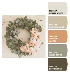 a wreath with flowers and greenery is shown in shades of brown, beige, and white