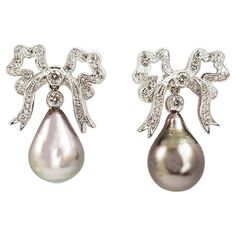 South Sea Pearl with Diamond Bow Earrings Set in 18K White Gold Settings Luxury White Gold Art Deco Earrings, 1stdibs Earrings, Organic Earrings, Diamond Bows, Pearl And Diamond Earrings, Diamond Brooch, Sea Pearl, Gold Earrings Designs, Bow Set