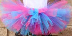 "A stunning, fluffy pink, purple, and blue tutu All tutus are made with high quality tulle and a 1\" non-roll waist band.  I make all my tutus very full and fluffy.  I put as much tulle as I can possibly fit. Each tutu has a matching bow attached. When measuring your child's waist, order the size that is 2 inches smaller than her actual waist since the band is made of elastic. Tutu Size Chart 0-6 mo         14\" waist    6\"length 6-12 mo       15\"waist     6\"length 12-24 mo     16\"waist Multicolor Tulle Tutu Dress For Wedding, Purple Tulle Tutu Dress For Birthday, Multicolor Tulle Tutu Dress, Cute Purple Tulle Tutu Dress, Purple Tulle Tutu Dress With Ruffles, Blue Tulle Skirt Tutu Dress For Birthday, Tutu Size Chart, Tutu Shirt, Blue Tutu