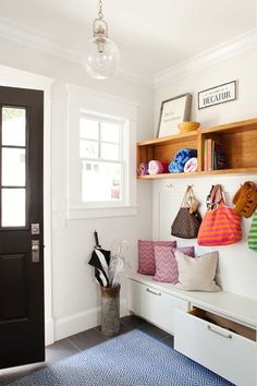 the entryway is clean and ready to be used as a storage area for purses