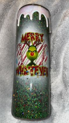 a christmas themed tumbler with the words merry whatever on it and an elf's nose