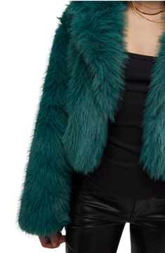 Cool and cropped, this luxe jacket made from plush faux fur in a relaxed fit with an exaggerated collar is sure to be a favorite all season long. 20" length (size Medium) Front button closure Notched collar Lined 100% polyester faux fur Dry clean Imported Faux Fur Long Sleeve Outerwear With Feather Trim, Faux Fur Outerwear With Feather Trim And Long Sleeves, Chic Faux Fur Outerwear With Feather Trim, Fall Faux Fur Outerwear With Feather Trim, Chic Cropped Jacket With Faux Fur Trim For Fall, Chic Cropped Jacket With Faux Fur Trim, Cropped Fur Jacket, Exaggerated Collar, Icon Clothing