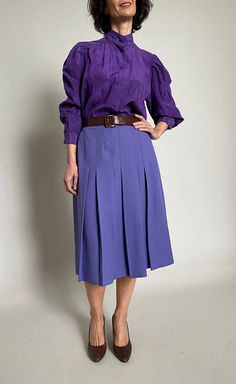 "Vintage purple pleated skirt for women size M, Chic  midi purple skirt for women Very chic, this skirt is pleated on the front. Fits M. Exact measurements of the skirt lying flat: length: 70 cm ( 27.55\") waist :   37 cm ( 14.56\" )                                              hips : 50 cm ( 19.68\" )   Vintage silk cotton purple blouse you can buy it in this shop: https://etsy.me/3mHPiCf. The model is 170 cm (5'6),size M and  measurements are: bust 88 cm ( 34.64\"), waist 75 cm ( 29.52\"), hips: 105 cm ( 41.33\").  I am Anne and I sell dresses and skirts mainly. Please have a look in my shop to find more elegant and chic vintage styles. Don't hesitate to contact me if you need more details!" Purple Pleated Skirt, Sell Dresses, Purple Skirt, Skirt For Women, Purple Blouse, Vintage Mode, Vintage Purple, Mode Vintage, Embroidered Blouse