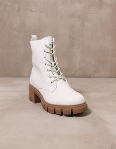 side of the ivory chinese laundry speed of white boot with chunky brown lug sole on cement background - elle bleu shoes Speed Of Light, White Boots, Chinese Laundry, Lug Sole, Ivory White, Side Zipper, Combat Boots, Vegan Leather, Ankle Boot