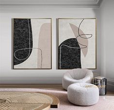 two abstract paintings hang on the wall above a round ottoman in a modern living room