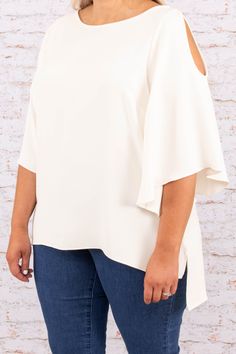 This cute top gives us major island vibes! This top has a solid neutral color you can dress up or down for every occasion! It's comfortable for all-day wear, has a flowy fit, and features the cutest cold shoulder sleeves! Style this top with skinnies and sandals for an easy everyday outfit! 100% Polyester Made In USA. Spring Cold Shoulder Tops For Day Out, Spring Vacation Cold Shoulder Tops, Spring Cold Shoulder Top For Brunch, Cold Shoulder Tops For Spring Brunch, Chic Cold Shoulder Tops For Day Out, Flowy Off-shoulder Blouse For Vacation, Casual Cold Shoulder Tops For Brunch, Spring White Cold Shoulder Blouse, White Cold Shoulder Blouse For Spring