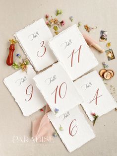 wedding table numbers laid out on top of each other