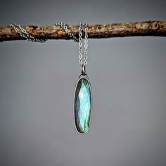 I've set a flashy faceted labradorite gem in sterling silver, with a sweet little hand-sawn botanical peekaboo accent on the back.  It hangs from a stainless steel chain adjustable at 16 inches and at 18 inches.  You will receive the exact necklace shown. Need a longer chain? Just send me a message!  I make all of my pieces myself in my home studio in Michigan. Follow me on Instagram @creationandchaos for updates, promotions, behind the scenes, and my art show schedule! Long Chain, Steel Chain, Stainless Steel Chain, Art Show, My Home, Pendant Necklaces, Labradorite, Necklace Etsy, Behind The Scenes