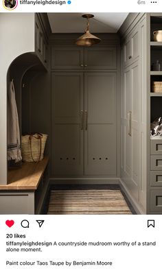 an instagramted photo of a hallway with grey cabinets