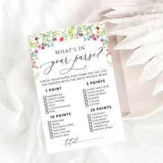 a printable what's in your purse checklist on a plate with flowers