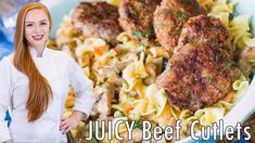 a woman standing in front of a bowl of pasta with meatballs and vegetables on it