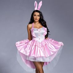 a woman dressed in bunny costume posing for the camera