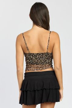 Unleash your wild side with the EMORY PARK Dark Leopard Print V Neckline Ruched Crop Top. This fierce top features a trendy leopard print and a flattering V neckline that will showcase your feminine style. The ruched detailing adds a touch of chicness while the cropped length gives you the perfect opportunity to show off your curves. Take your fashion game to the next level with this must-have piece! SIZE & FIT :MODEL WEARS SIZE SMALLMODEL'S HEIGHT 5'9 Made In: USA Fitted Black Top With Tiger Print, Fitted Black Tiger Print Top, Trendy Leopard Print Tops For Night Out, Leopard Print V-neck Tops For Night Out, Leopard Print Top For Spring Party, Leopard Print Tops For Night Out In Spring, Leopard Print Tops For Spring Night Out, Fitted Leopard Print Tops For Spring, Trendy Leopard Print Tops For Party