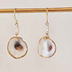 These beautiful earrings are created using Small Oyster  shells.  Hook earrings gold finish. They have a stunning Pearl accent stone on a silver hook.  Made by yours truly,               Becca Hook Earrings Gold, Earrings With Pearls, Oyster Shells, Oyster Shell, Shell Earrings, Denver Co, Yours Truly, Hook Earrings, Earrings Gold