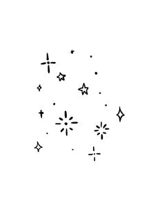 a black and white photo of fireworks in the sky with stars coming out of them