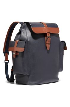 Perfectly equipped for travel, this sturdy leather backpack is furnished with exterior snap-flap pockets and a padded laptop compartment. Flap top with buckle-strap closure Adjustable backpack straps Two exterior snap-flap pockets Interior wall pockets; laptop pocket Laptop pocket fits most 16" laptops Trolley sleeve Lined Leather Imported Travel Backpack With Flap, Leather Backpack With Detachable Strap For Business, Classic Backpack With Flap, Luxury Travel Backpack With Leather Trim, Classic Travel Backpack With Detachable Strap, Luxury Leather Coated Canvas Backpack For Travel, Classic Business Backpack With Leather Trim, Classic Leather Trim Backpack For Business, Leather Flap Bag With Buckle Closure