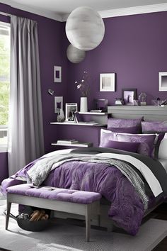 a bedroom with purple walls and white furniture