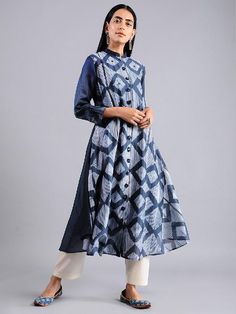 An Indigo diamond shaped all over shibori jacket dress with mirror work and flower shapped handmade buttons. This dress comes with a separate matching slip in mul. Features: Front open jacket dress with 3/4th sleeves Shell - pure cotton silk fabric Lining - separate matching slip in soft cotton Handmade in India Measurements: Size XS : Bust-34", Waist-33", Hip-Flared, Shoulder-14", Length-47", Sleeve length-18" Size S : Bust-36", Waist-35", Hip-Flared, Shoulder-14.5", Length-47", Sleeve length-1 Dress With Mirror Work, Cotton Silk Fabric, Handmade Buttons, Open Jacket, Mirror Work, Diamond Shaped, Best Deal, Shibori, Cotton Silk