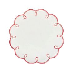 a white plate with red trim around the edge and an oval shape at the center