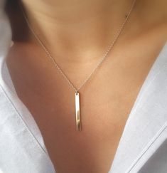 Simple, sleek and unique. This two tone sterling silver chain and 14k gold fill bar necklace can pretty much go with any outfit. This design is a great dress up dress down piece that can easily become your everyday necklace. 14k gold bar is 30 mm x 3 mm. Rollo sterling silver chain and 14k gold fill spring ring clasp. Please make sure to select your desired length in the drop down menu. Model is wearing a 15 inch necklace. Your necklace will arrive in a small jewelry gift box with bow. Sterling Silver Bar Necklace For Everyday, Simple Bar Necklace With Delicate Chain, Silver Dainty Bar Necklace For Everyday, Modern Bar Necklace For Everyday Wear, Simple Everyday Bar Necklace With Delicate Chain, Silver Bar Necklace With Delicate Chain For Everyday, Everyday Silver Bar Necklace With Delicate Chain, Dainty Sterling Silver Bar Necklace For Everyday, Minimalist Everyday Bar Necklace With Delicate Chain