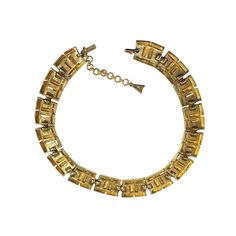 Elevate your jewelry collection with this exquisite Monet gold-tone link choker collar necklace that exudes sophistication and luxury. Measuring 16.5 inches in length by 1 inch in height and just 0.25 inches in depth, it is the perfect statement piece for any occasion.In 1937, the Chernow brothers changed the company's name and began marketing the jewelry under the name Monet. Over the years the Monet Company has been sold several times. Throughout the changes they have always produced affordabl Elegant 16 Inch Metal Choker, Gold-tone Necklaces With Gold Clasp For Formal Occasions, Formal Gold-tone Necklaces With Gold Clasp, Gold-tone Metal Chain Necklace For Formal Occasions, Formal Gold-tone Necklace With Gold Clasp, Gold Jeweled Costume Jewelry Choker, Formal Gold-tone Metal Chain Necklace, Gold Chain Necklace With Gold Clasp For Formal Occasions, Gold-tone Costume Jewelry Choker Necklace