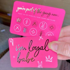 two pink stickers that say i'm local babe and you're off the song now