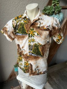 This spectacular, genuine 1970s vintage Hawaiian shirt has lot going including surfers, sailboats, huge waves, breezy palms, thatched huts and more. Excellent fit, feel and condition. Feels like 100% polynesian polyester. SIZE: Pit to Pit: 21" Collar to hem: 25.5" Sleeves: 8" The tag is gone. It fits like a modern men's medium or short large. The male mannequin would be 5'10" 175 lbs. ITEM 1 Casual Vintage Print Camp Shirt For Vacation, Cotton Tops With Retro Print For The Beach, Retro Cotton Beach Shirt, Retro Short Sleeve Shirt For Beach Season, Vintage Cotton Hawaiian Shirt For Vacation, Beach Cotton Camp Shirt With Vintage Print, Beach Camp Shirt With Vintage Print, Vintage Short Sleeve Camp Shirt For Beach Season, Cotton Camp Shirt With Vintage Print For Beach