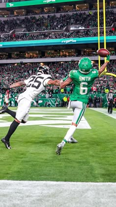 two football players in action on the field