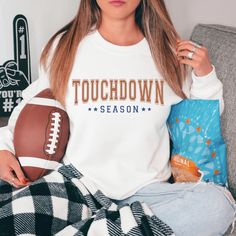 Wrap yourself up in cozy comfort for the football season with this trendy football sweatshirt. This football crew is the perfect addition to your closet featuring a trendy retro design great for standing out in the crowd. This crewneck is versatile enough to wear for both casual and dressed-up occasions. This shirt is the perfect gift for your college student, Mother's Day, birthday, football season, Christmas, or whatever the occasion. *Gildan 18000 Unisex Adult Crewneck Sweatshirt *White Pictu Game Day Football Season Crew Neck Sweatshirt, Football Season Game Day Crew Neck Sweatshirt, Collegiate Football Season Sweatshirt With Letter Print, Collegiate Letter Print Sweatshirt For Football Season, College Football Season Letter Print Sweatshirt, College Sweatshirt With Letter Print For Football Season, Football Season Game Day Cotton Sweatshirt, White Sweatshirt For Football Season Game Day, Cotton Sweatshirt For Game Day, Football Season