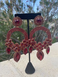 oversized deep red/ garnet earrings    length: 5.5 inches long by 2.5 inches wide Red Ruby Dangle Chandelier Earrings, Burgundy Drop Earrings For Party, Ruby Chandelier Drop Earrings For Party, Red Glamorous Chandelier Earrings For Evening, Glamorous Red Chandelier Earrings For Evening, Red Glamorous Chandelier Earrings For Party, Glamorous Red Chandelier Earrings For Party, Burgundy Earrings For Party, Red Garnet Earrings