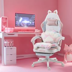 a white chair sitting in front of a computer desk