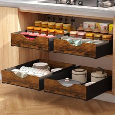 two wooden drawers filled with food and condiments on top of a kitchen counter