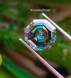 a close up view of a crystal ball on two metal rods with the words brindabykniaal above it