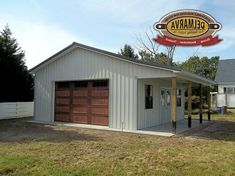 a white garage with a red sign above it