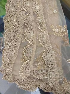 the back of a dress with beading on it