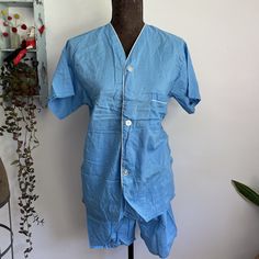 Great vintage 1960s blue cotton summer pajamas set. Brand is John Wells LTD.  Tagged size B but please see measurements for best fit.  Best size guess is a men's XS/small or women's medium depending on desired fit.   Elastic waist band. Great vintage condition with no flowers found.  Measurements taken flat. Double where applicable.  Shirt  pit to pit 19 inches  length 27 inches  shorts  waist 13 to about 17 inches stretched Rise 14 inches  hips 20 1/2 inches  inseam 5 inches Light Blue Cotton Pajama Party Set, Light Blue Summer Sleepwear For Home, Light Blue Cotton Sleepwear For Home, Light Blue Cotton Sleepwear, Blue Cotton Short Sleeve Sleepwear, Blue Cotton Short Set For Loungewear, Blue Summer Home Sets, Cotton Blue Tops For Home, Blue Cotton Tops For Home