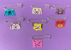 six pairs of beaded hair clips on a purple background